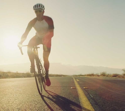 Cyclist on open road
