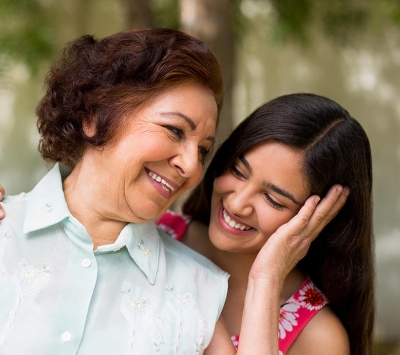 Grandmother and grand daughter embracing 