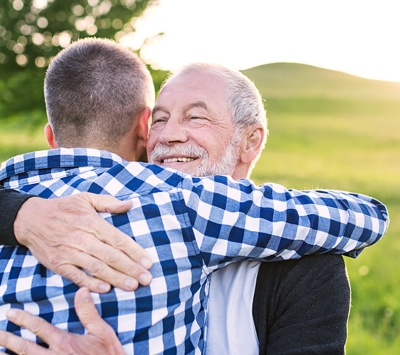 Mature father and son outdoors