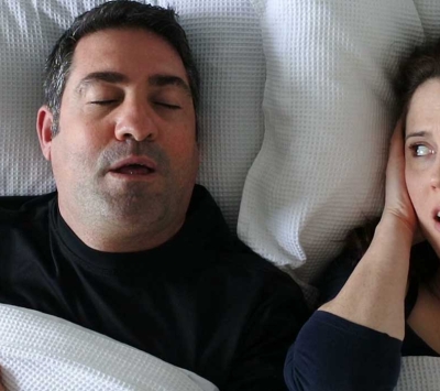 wife annoyed by husband's snoring