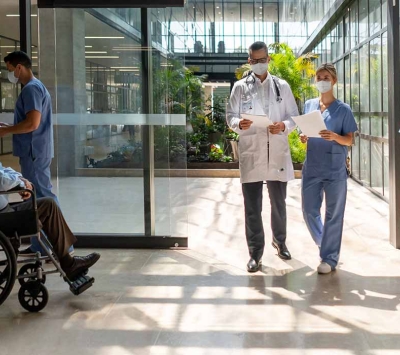 Healthcare workers and patients wearing protective masks.