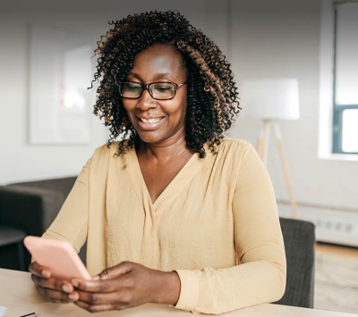 Mature woman using her smartphone.