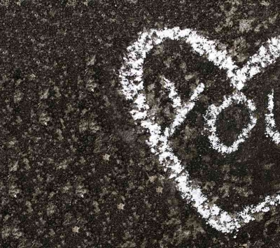 Street caulk drawing of heart and word you 