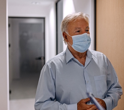 Senior patient greeted by medical resident