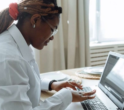 woman typing on a laptop
