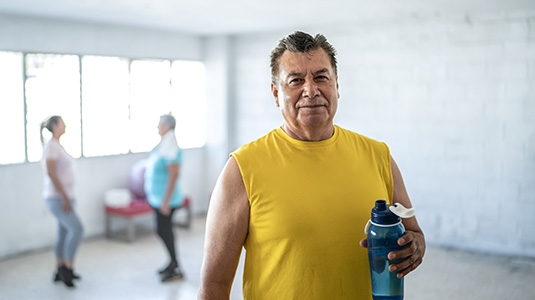 Middle aged man in fitness class