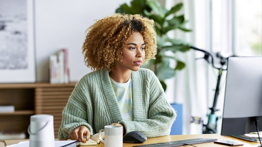 diverse woman viewing computer