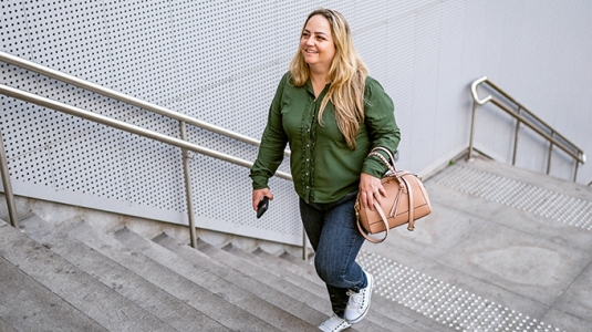 Woman walking up stairs