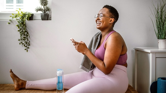 Diverse woman viewing phone 