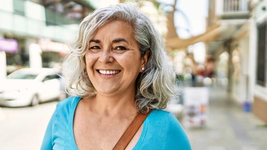 Happy mature woman outside portrait