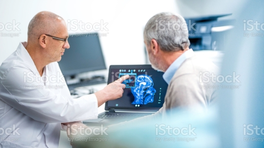 neurologist consulting patient on images
