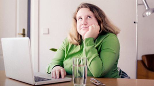 women on computer thinking