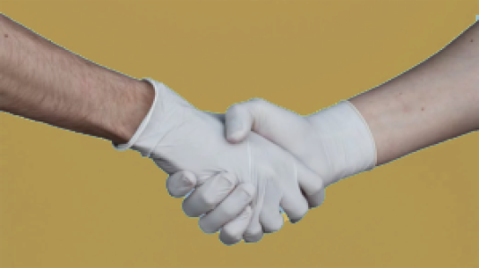 hands with rubber gloves in a handshake