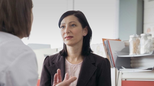 woman and doctor speaking