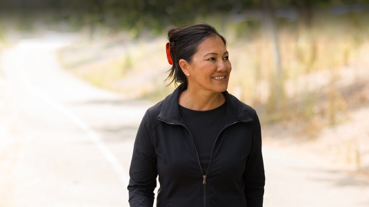 mature asian woman walking outdoors
