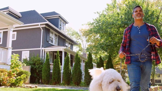 man walking his dog with healthy lungs