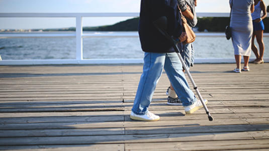 older couple walking on boardwalk