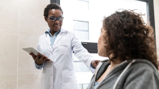 Doctor comforting a patient