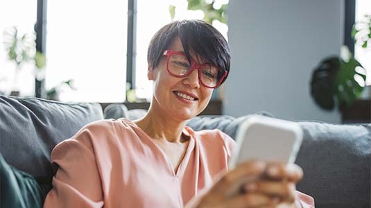 Middle aged woman using phone