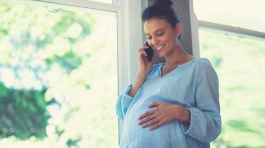 Pregnant Woman On Phone