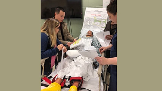 Nurses with sim lab dummy