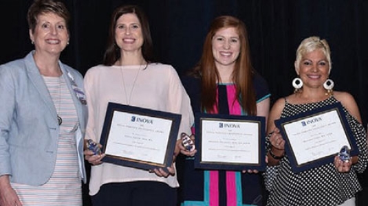 nurses posing with their awards