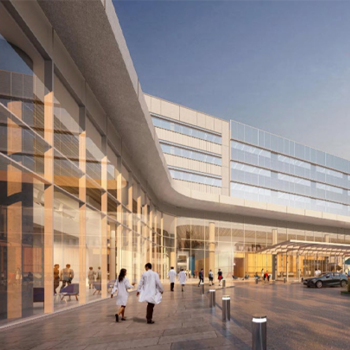 Two physicians walking in front of building