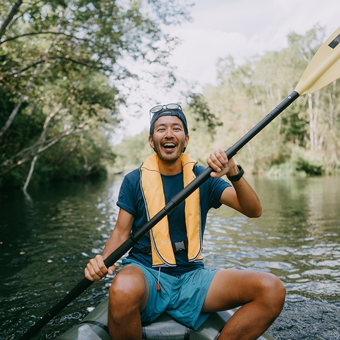 Asian man rafting
