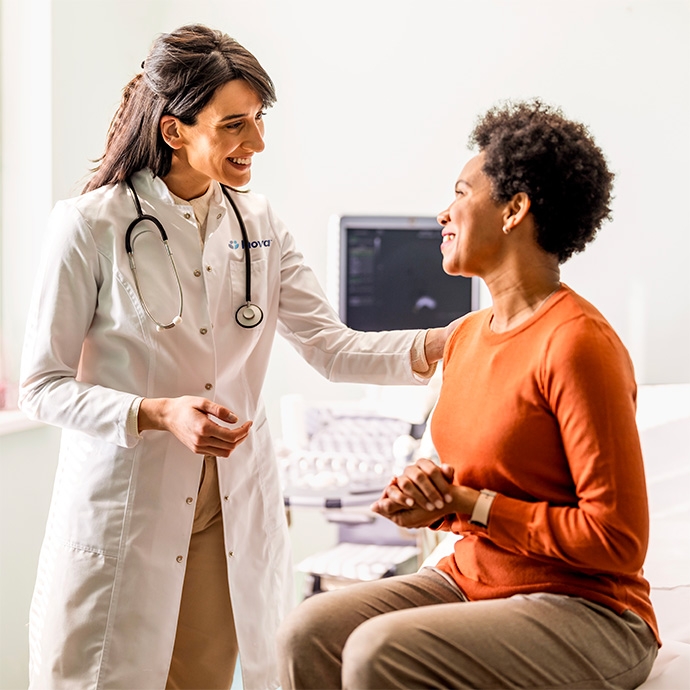 Female doctor conversation with female patient in office 