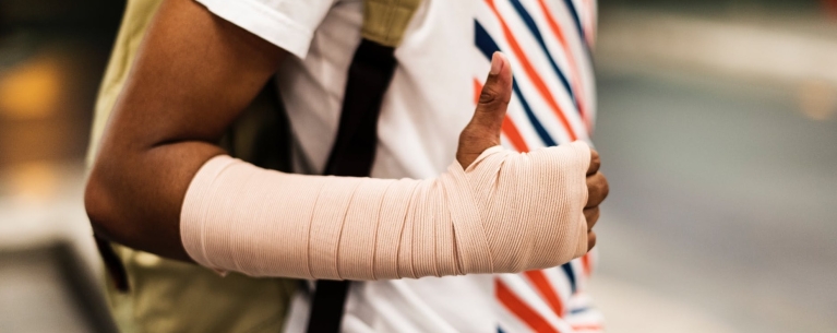closeup of young person with arm in bandage
