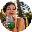 happy woman drinking fruit shake