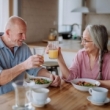 mature couple toasting glasses